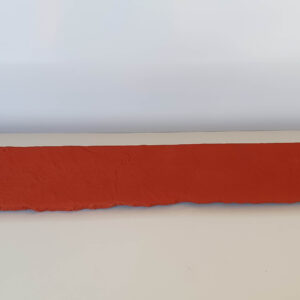 Red faux brick sill piece with a rough texture and natural edge